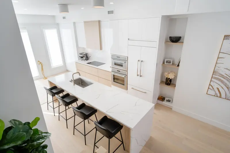 Marble-look island countertop in a minimalist kitchen