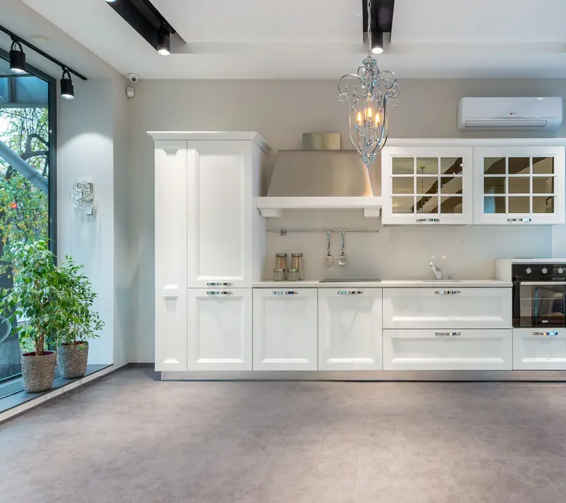 Kitchen display with white cabinets in a showroom setting